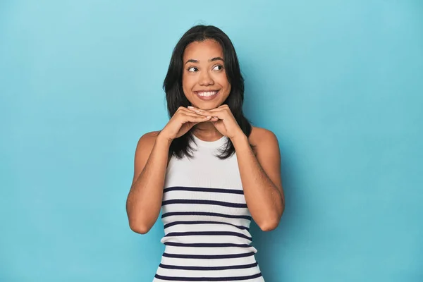 Filipina Young Woman Blue Studio Keeps Hands Chin Looking Happily — Stock Photo, Image