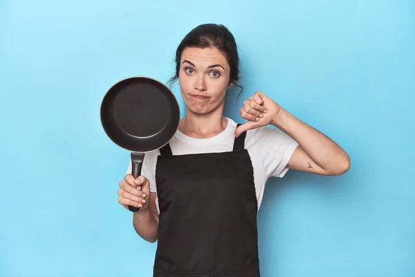 Woman Apron Pan Blue Background Showing Dislike Gesture Thumbs Disagreement — Stock Photo, Image
