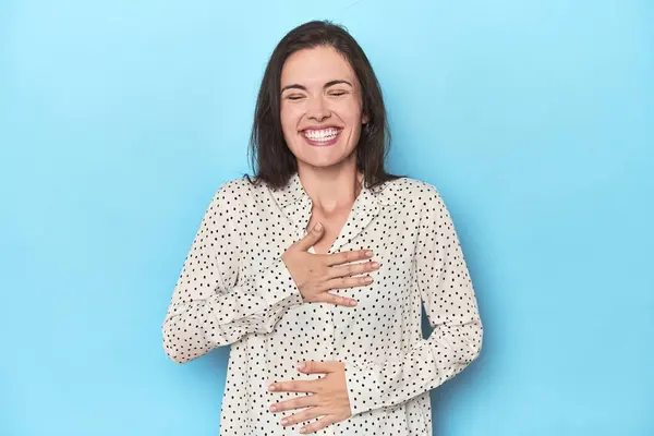 Young Caucasian Woman Blue Backdrop Laughs Happily Has Fun Keeping — Stock Photo, Image
