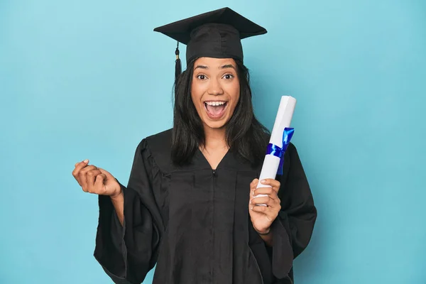 Celebrating Filipina Graduate Diploma Cap Blue Studio — Stock Photo, Image