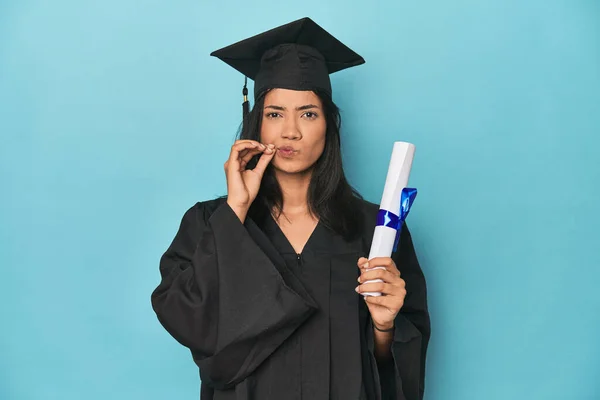 Filipina Graduate Diploma Blue Studio Fingers Lips Keeping Secret — Stock Photo, Image