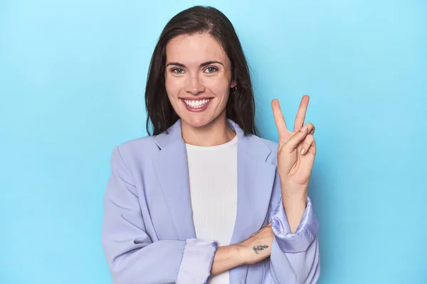 Woman Blue Blazer Blue Background Showing Number Two Fingers — Stock Photo, Image