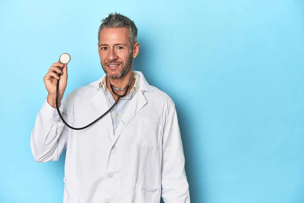 Doctor Holding Stethoscope Blue Studio Backdrop — Stock Photo, Image