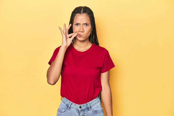 Young Indonesian Woman Yellow Studio Backdrop Fingers Lips Keeping Secret — Stock Photo, Image