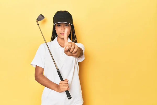 Indonesian Female Golfer Yellow Backdrop Showing Number One Finger — Stock Photo, Image