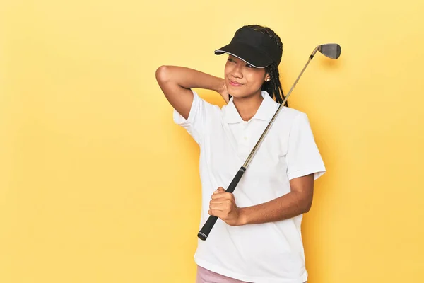 Indonesian Female Golfer Yellow Backdrop Touching Back Head Thinking Making — Stock Photo, Image