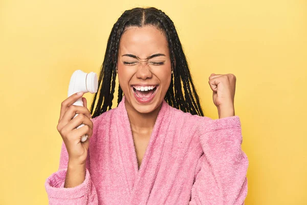 Indonesian Woman Facial Cleaner Yellow Raising Fist Victory Winner Concept — Stock Photo, Image