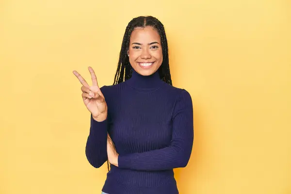 Young Indonesian Woman Yellow Studio Backdrop Showing Number Two Fingers — Stock Photo, Image