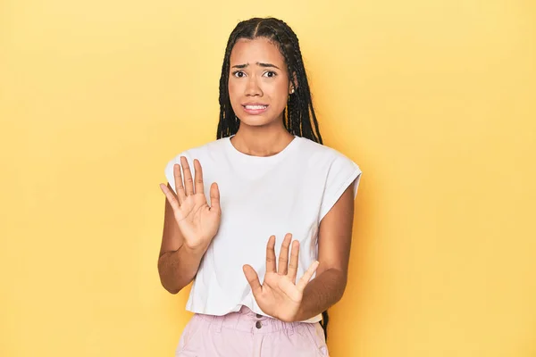 Young Indonesian Woman Yellow Studio Backdrop Rejecting Someone Showing Gesture — Stock Photo, Image
