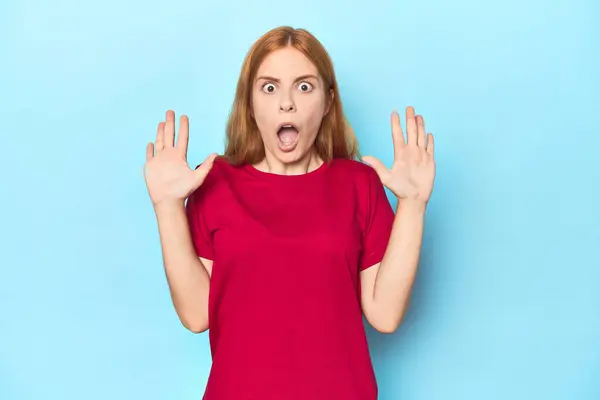 Redhead Young Woman Blue Background Receiving Pleasant Surprise Excited Raising — Stock Photo, Image