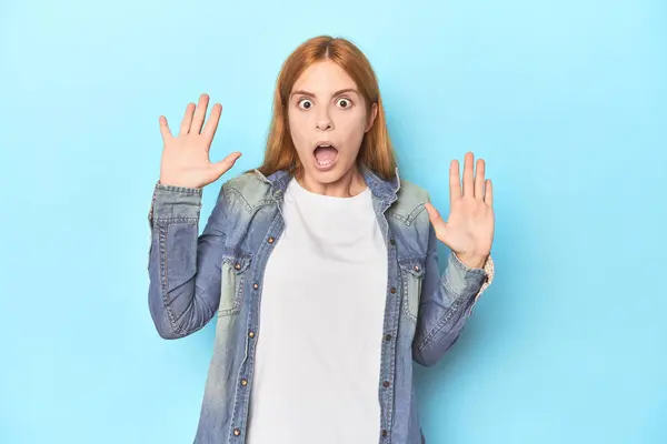 Redhead Young Woman Blue Background Receiving Pleasant Surprise Excited Raising — Stock Photo, Image