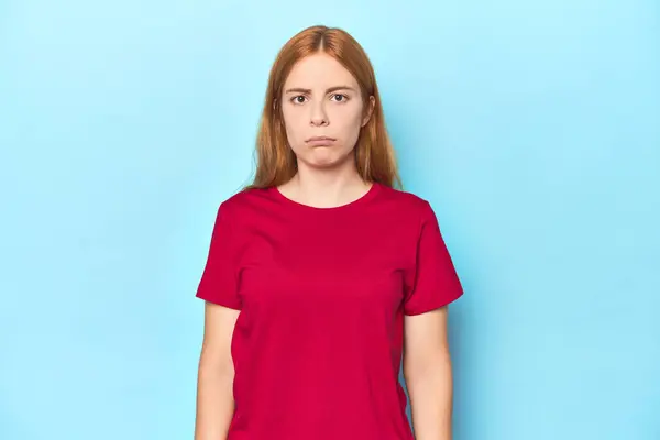 Redhead Young Woman Blue Background Sad Serious Face Feeling Miserable — Stock Photo, Image