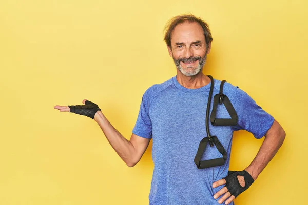 Man Exercising Bands Studio Showing Copy Space Palm Holding Another — Stock Photo, Image