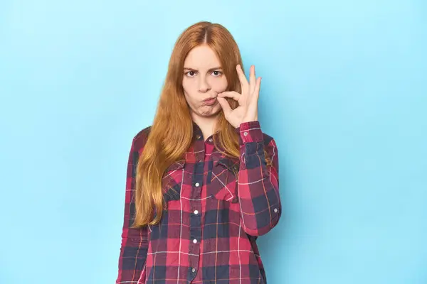 Redhead Young Woman Blue Background Fingers Lips Keeping Secret — Stock Photo, Image