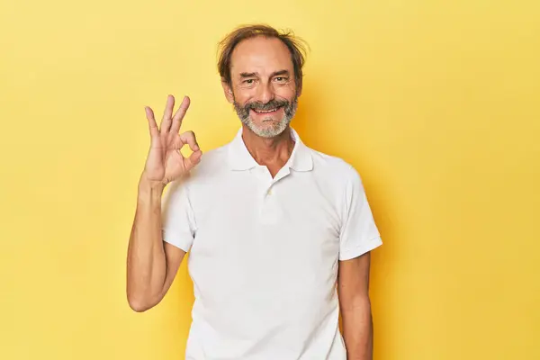 Caucasian Middle Aged Man Yellow Studio Cheerful Confident Showing Gesture — Stock Photo, Image