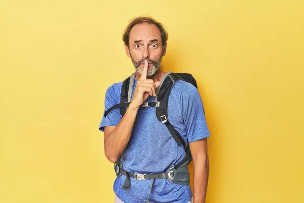 Middle Aged Hiker Backpack Studio Keeping Secret Asking Silence — Stock Photo, Image
