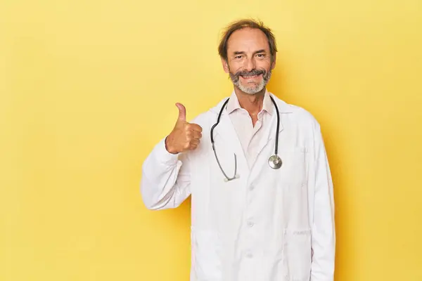Doctor Stethoscope Yellow Studio Smiling Raising Thumb — Stock Photo, Image