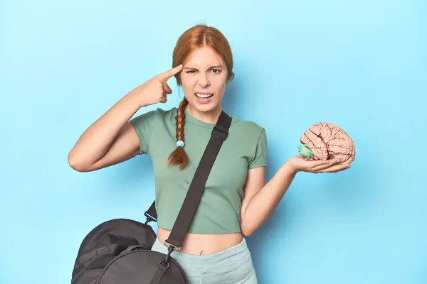 Sporty Redhead Brain Model Blue Background Showing Disappointment Gesture Forefinger — Stock Photo, Image