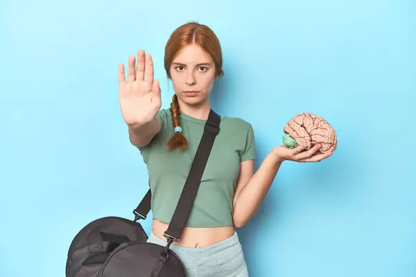 Sporty Redhead Brain Model Blue Background Standing Outstretched Hand Showing — Stock Photo, Image