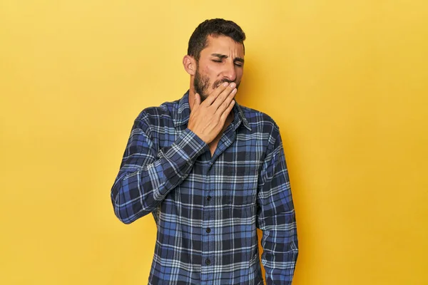 Young Hispanic Man Yellow Background Yawning Showing Tired Gesture Covering Royalty Free Stock Photos
