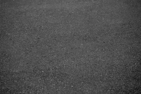 黒い色のアスファルト道路の背景 — ストック写真