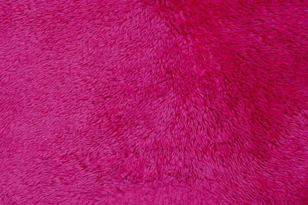 Luxury fashionable of pink fur coat texture for background It\'s soft winter fashion hanging.