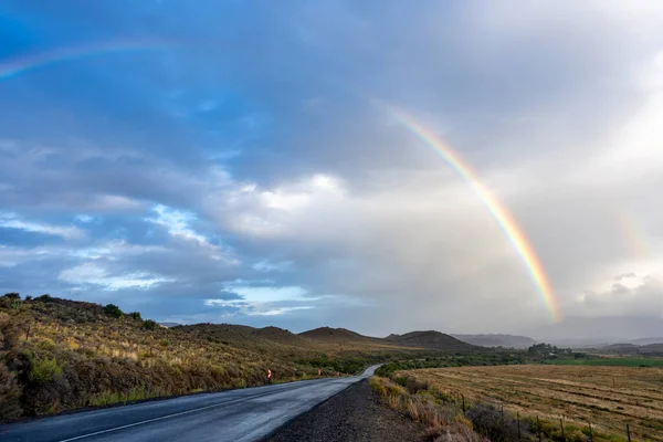 A rainbow after a Karoo storm along the N12 just outside Klaarstroom. Western Cape. South Africa