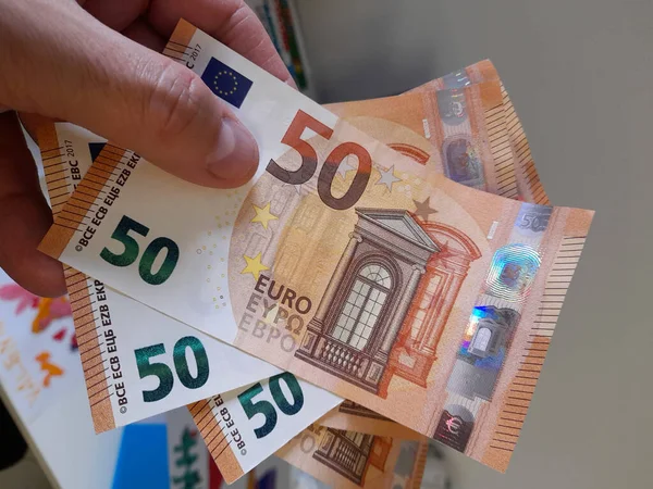 stock image Banknotes of 50 euros in the hands of a wealthy man