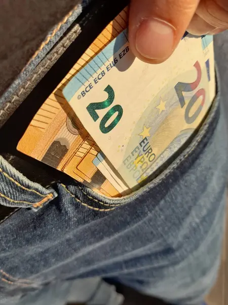 20 and 50 euro banknotes in the hands of a man - wealth