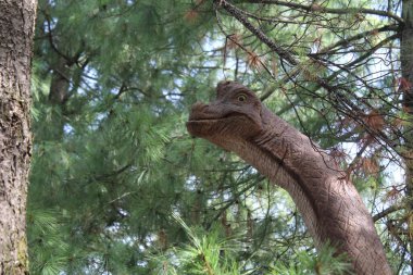 Reconstruction of a dinosaur in nature - very long neck clipart