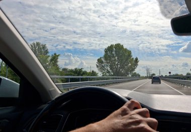 Man driving car on city streets