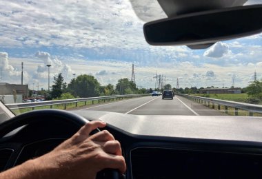 Man driving car on city streets