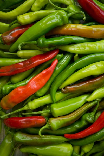 stock image Hot chili pepper background. Red and green peppercorns as a background. Healthy food concept.