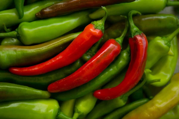 stock image Hot chili pepper background. Red and green peppercorns as a background. Healthy food concept.