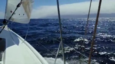 Yachting in the Canary Islands, Spain. Sailing in the ocean. View from the bow of a yacht under sail at full speed in the ocean.