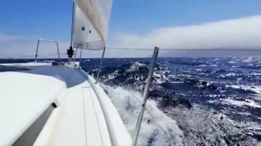 Yachting in the Canary Islands, Spain. Sailing in the ocean. View from the bow of a yacht under sail at full speed in the ocean.