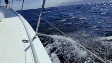 Yachting in the Canary Islands, Spain. Sailing in the ocean. View from the bow of a yacht under sail at full speed in the ocean.