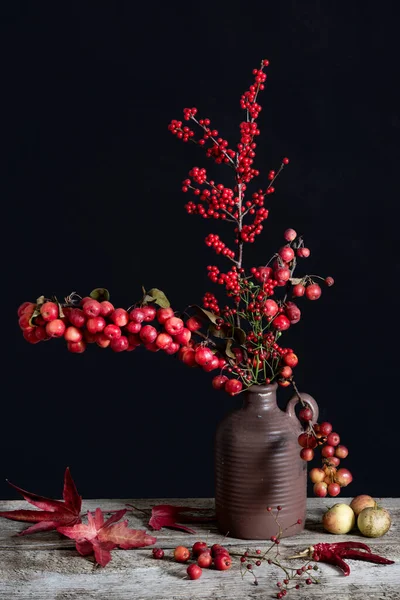 bunch of berries on the table in a vase. . High quality photo