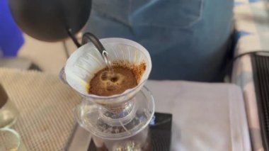 Barista making craft filter drip coffee at cafe indoor. High quality 4k footage