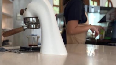 Man barista making espresso coffee in cafe. High quality 4k footage