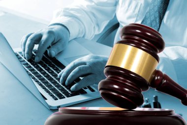 A man in the office and a judge's gavel