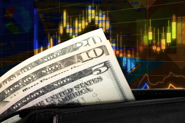 finansal grafik ve enflasyon yazıtı ve dolar banknotları