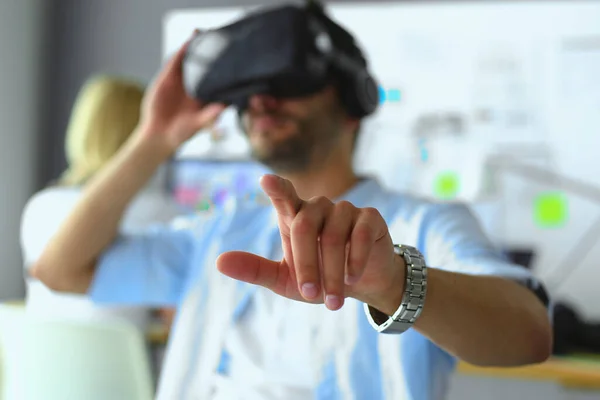 stock image Young male software programmer testing a new app with 3d virtual reality glasses in office