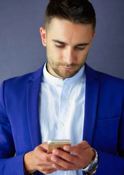 Young Businessman Sitting Isolated Grey Background — Stock Photo, Image