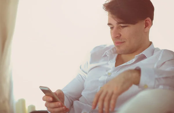 Handsome Young Man Using Smartphone Home — Stock Photo, Image