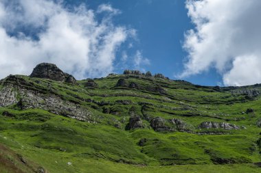 Karst landforms in green steep mountain slope, Cantabria, Spain