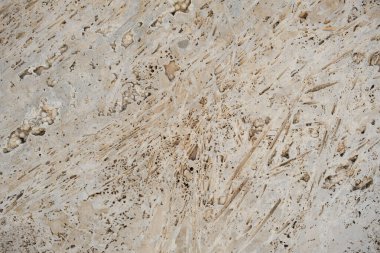 Gözenekli soyut doku ve seçici odak noktalarını kaplayan beton biçimindeki duvar ayrıntıları