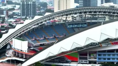 Detailed shot famous Estadio Nacional de Costa Rica. Modern sports stadium with roofed tribunes. San Jose, Costa Rica.