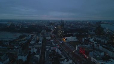 Aerial panoramic view of city at dusk. Entertainment St. Pauli district with famous Reeperbahn street. Hamburg, Germany.