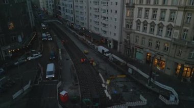 High angle view of workers preparation on construction site in morning. Refurbishment of tracks on tram line in urban borough. Berlin, Germany.